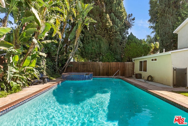 view of swimming pool with a patio area and a lawn