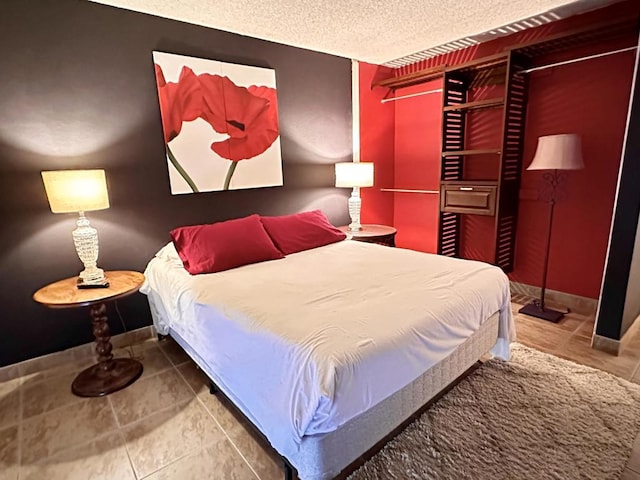 bedroom featuring a textured ceiling