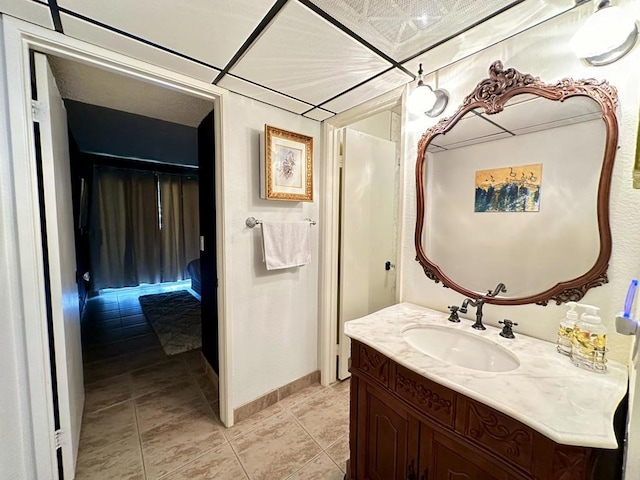 bathroom with tile patterned flooring and vanity