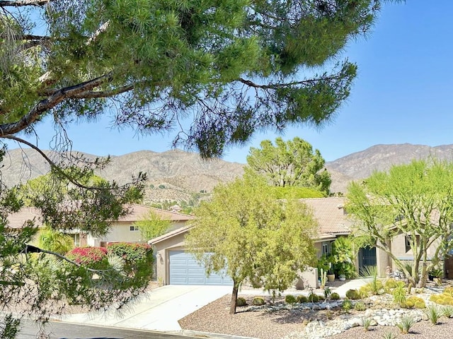 exterior space featuring a mountain view and a garage