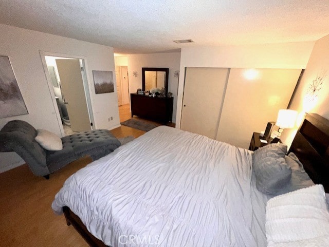 bedroom featuring a closet and a textured ceiling