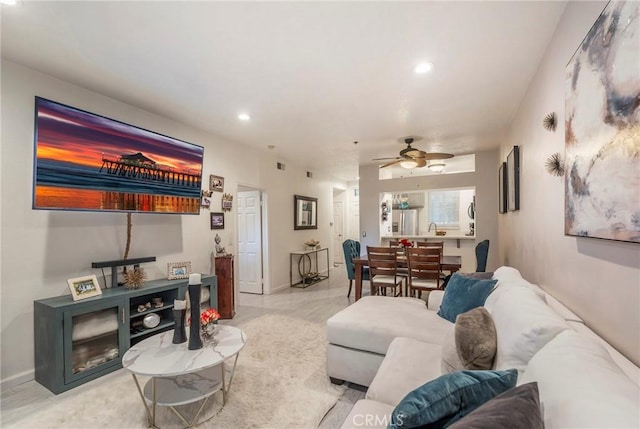 living room featuring ceiling fan