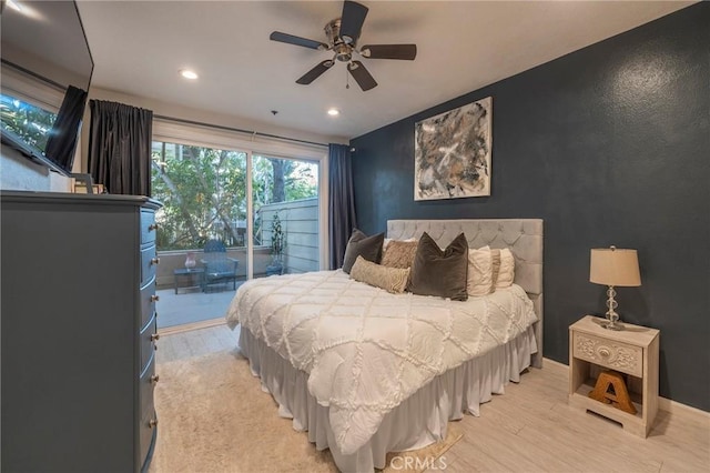 bedroom featuring light hardwood / wood-style floors, access to exterior, and ceiling fan