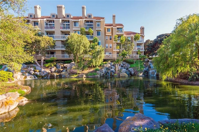 surrounding community featuring a water view