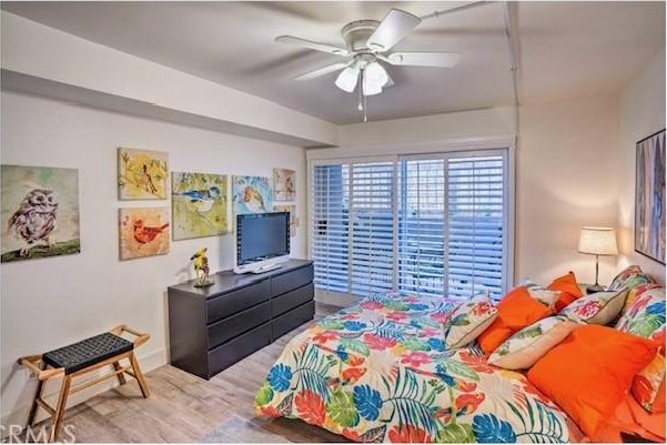 bedroom featuring light hardwood / wood-style floors and ceiling fan