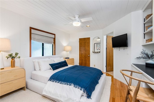 bedroom with light hardwood / wood-style floors and ceiling fan