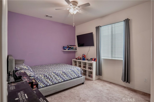 carpeted bedroom featuring ceiling fan