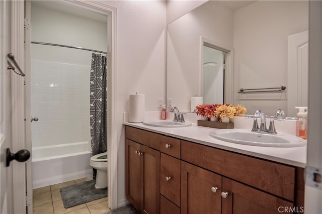 full bathroom featuring vanity, shower / tub combo with curtain, toilet, and tile patterned floors