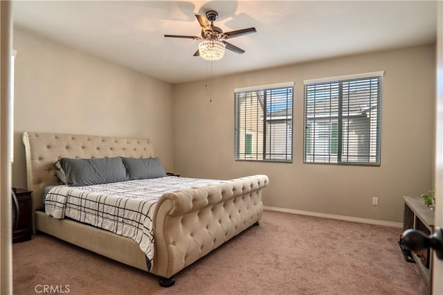 bedroom featuring light colored carpet and ceiling fan