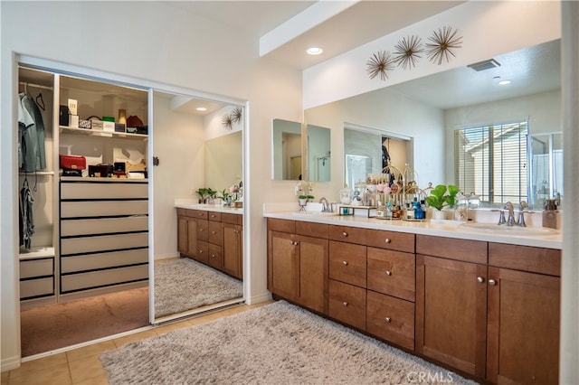 bathroom with vanity and tile patterned flooring