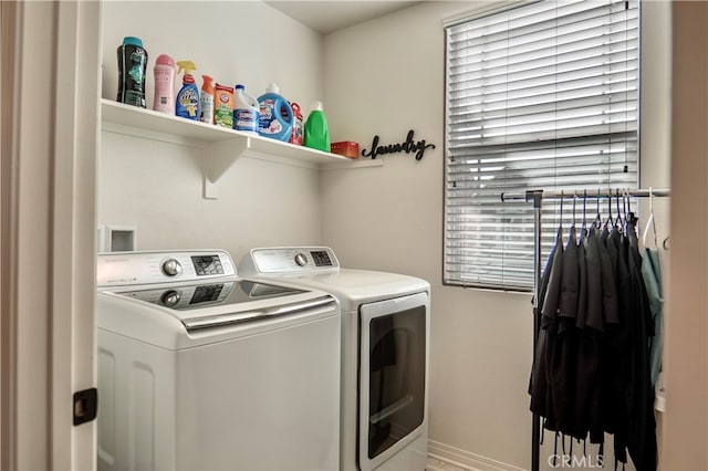 laundry room featuring plenty of natural light and washing machine and dryer