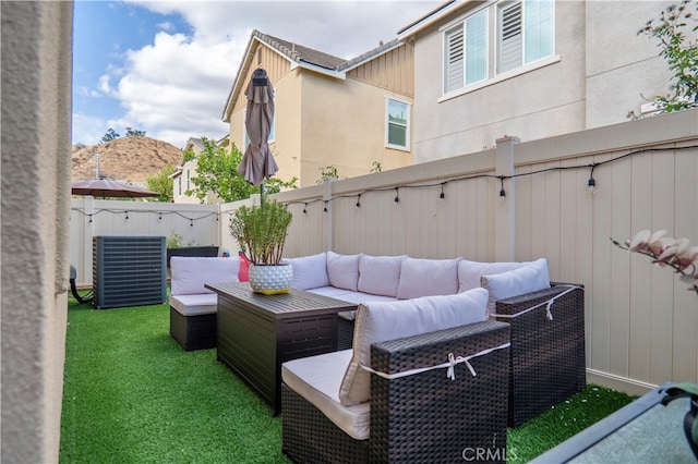 view of patio with outdoor lounge area and a mountain view