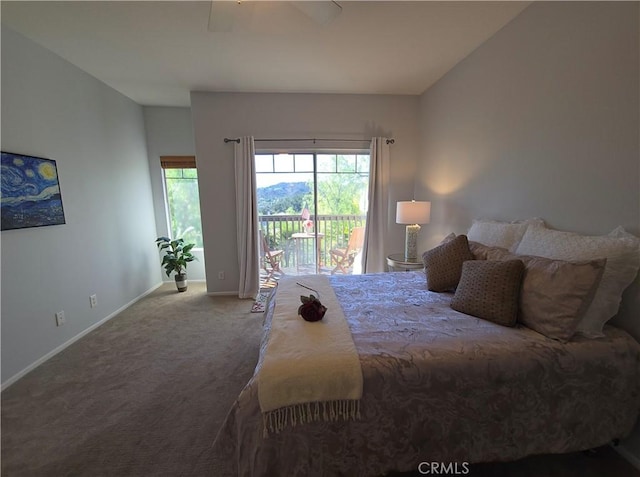 carpeted bedroom featuring ceiling fan and access to exterior