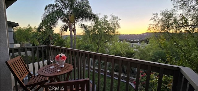 view of balcony at dusk