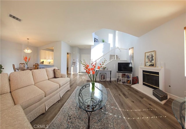 living room with dark hardwood / wood-style flooring