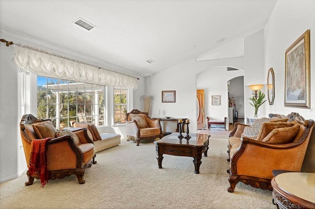 living room with vaulted ceiling and carpet flooring