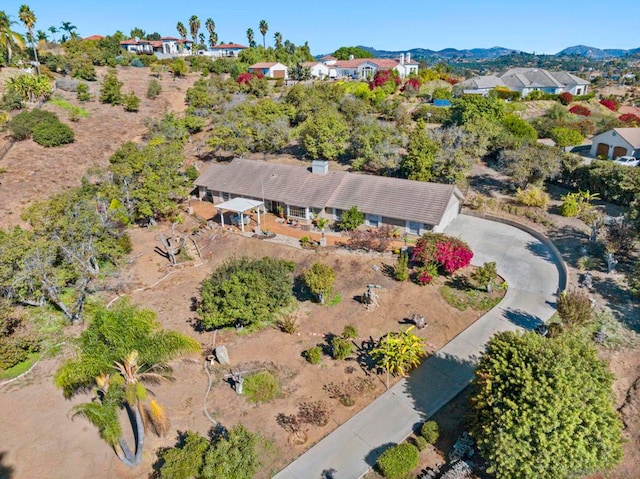 birds eye view of property with a mountain view