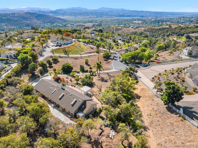 birds eye view of property with a mountain view