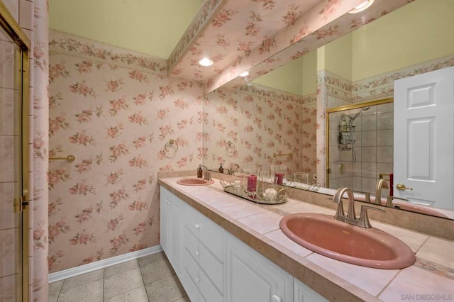 bathroom featuring walk in shower, vanity, and tile patterned flooring