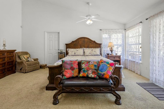 carpeted bedroom featuring ceiling fan and vaulted ceiling