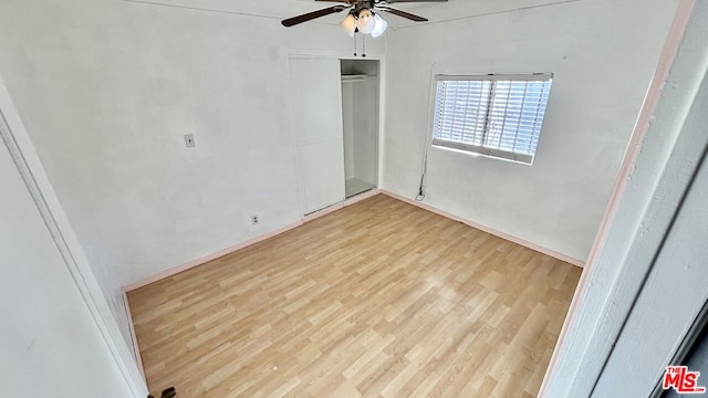 unfurnished bedroom featuring light hardwood / wood-style flooring and ceiling fan