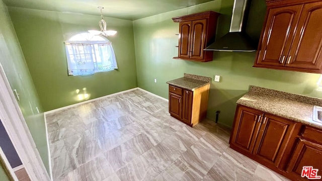 kitchen featuring wall chimney exhaust hood