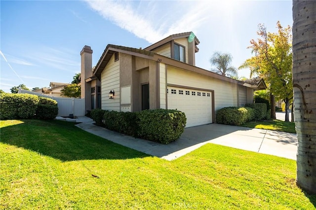 view of property exterior with a yard and a garage