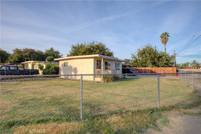 view of property exterior with a lawn