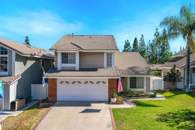 view of front property with a garage and a front yard