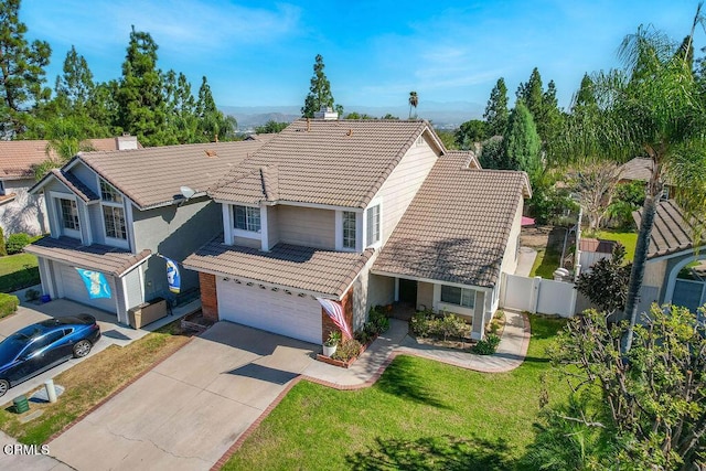 view of front of property with a front lawn and a garage