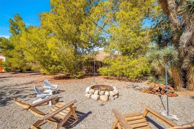 view of yard featuring a fire pit