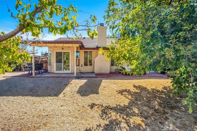 back of property featuring a patio area