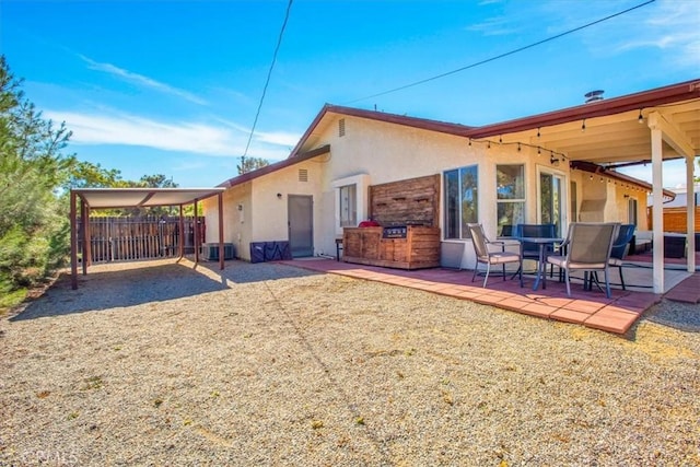 back of house featuring a patio area