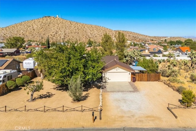 birds eye view of property featuring a mountain view