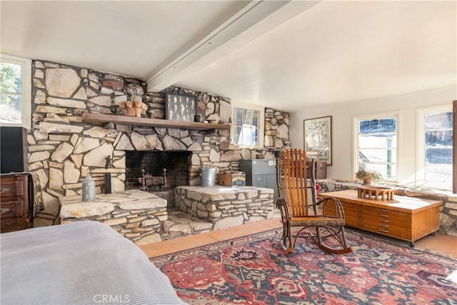 living room with a fireplace and beam ceiling