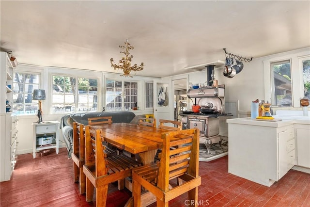 dining space with dark hardwood / wood-style flooring