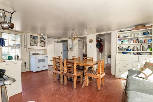 dining area with dark hardwood / wood-style floors