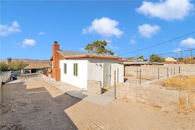 back of house with a patio area