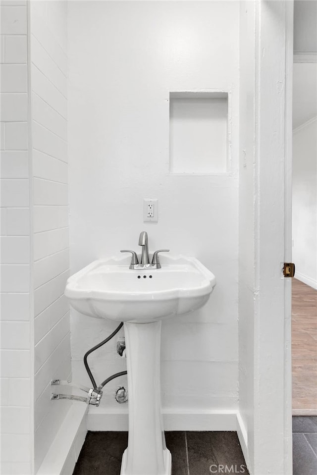 bathroom featuring sink and hardwood / wood-style floors