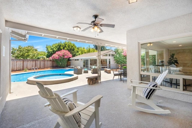 view of pool featuring an outdoor hangout area, a patio, and an in ground hot tub