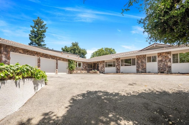 ranch-style home with a garage