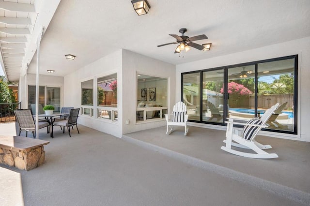 view of patio featuring ceiling fan