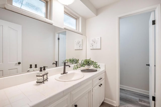 bathroom with vanity and wood-type flooring