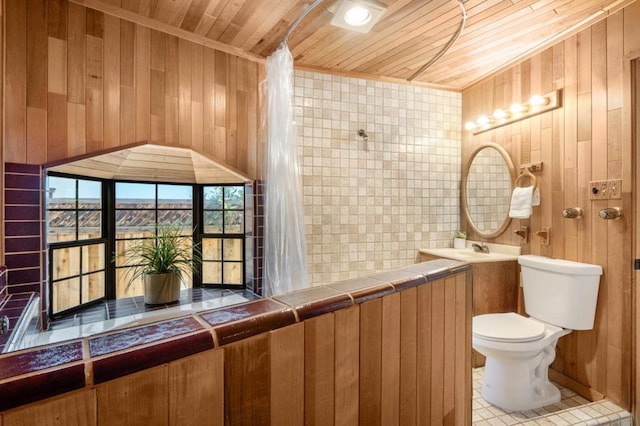 bathroom featuring wooden walls, tile patterned floors, toilet, and wooden ceiling