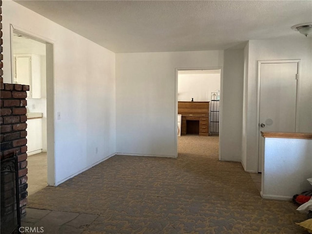 interior space with a textured ceiling