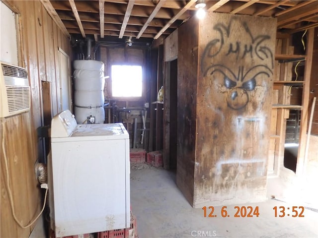 clothes washing area featuring washer / dryer and a wall mounted AC