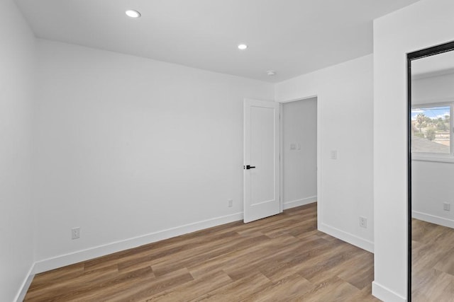 unfurnished room featuring light hardwood / wood-style floors