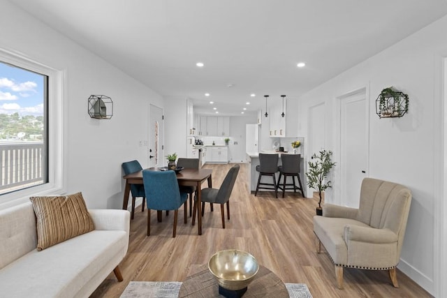 dining space with light wood-type flooring