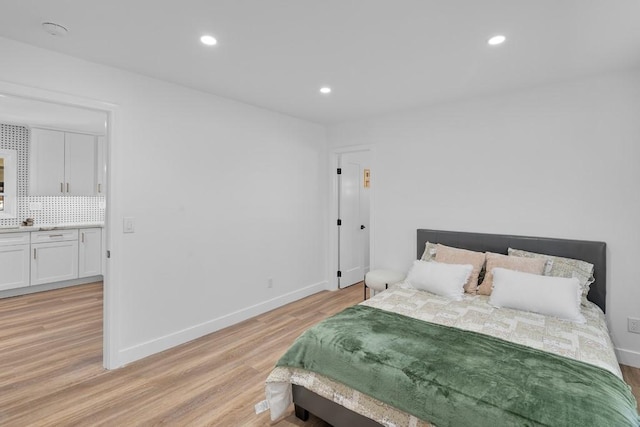 bedroom with light hardwood / wood-style floors