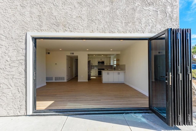 doorway to property featuring sink